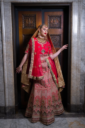 Photo of Red and gold bridal lehenga with sequin work all over